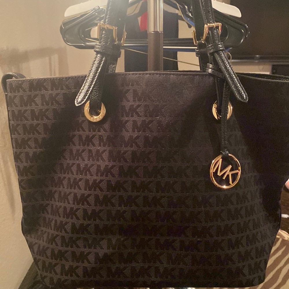 Michael Kors purse. Black with gold accents.